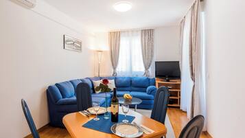 Apartment (Apartment Blue Lagoon (ST) - One Bedr) | Living room | 32-inch flat-screen TV with cable channels