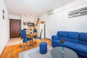 Apartment (Apartment Blue Lagoon (ST) - One Bedr) | Living room | 32-inch flat-screen TV with cable channels - Apartment Blue Lagoon (Split)