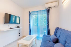 Apartment (Two Bedroom Apartment with Balcony (M) | Living room | 32-inch flat-screen TV with cable channels