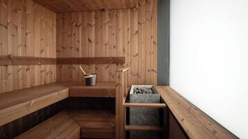 Una sauna con bancos de madera y un estante de madera con un cubo y una caja de leña.