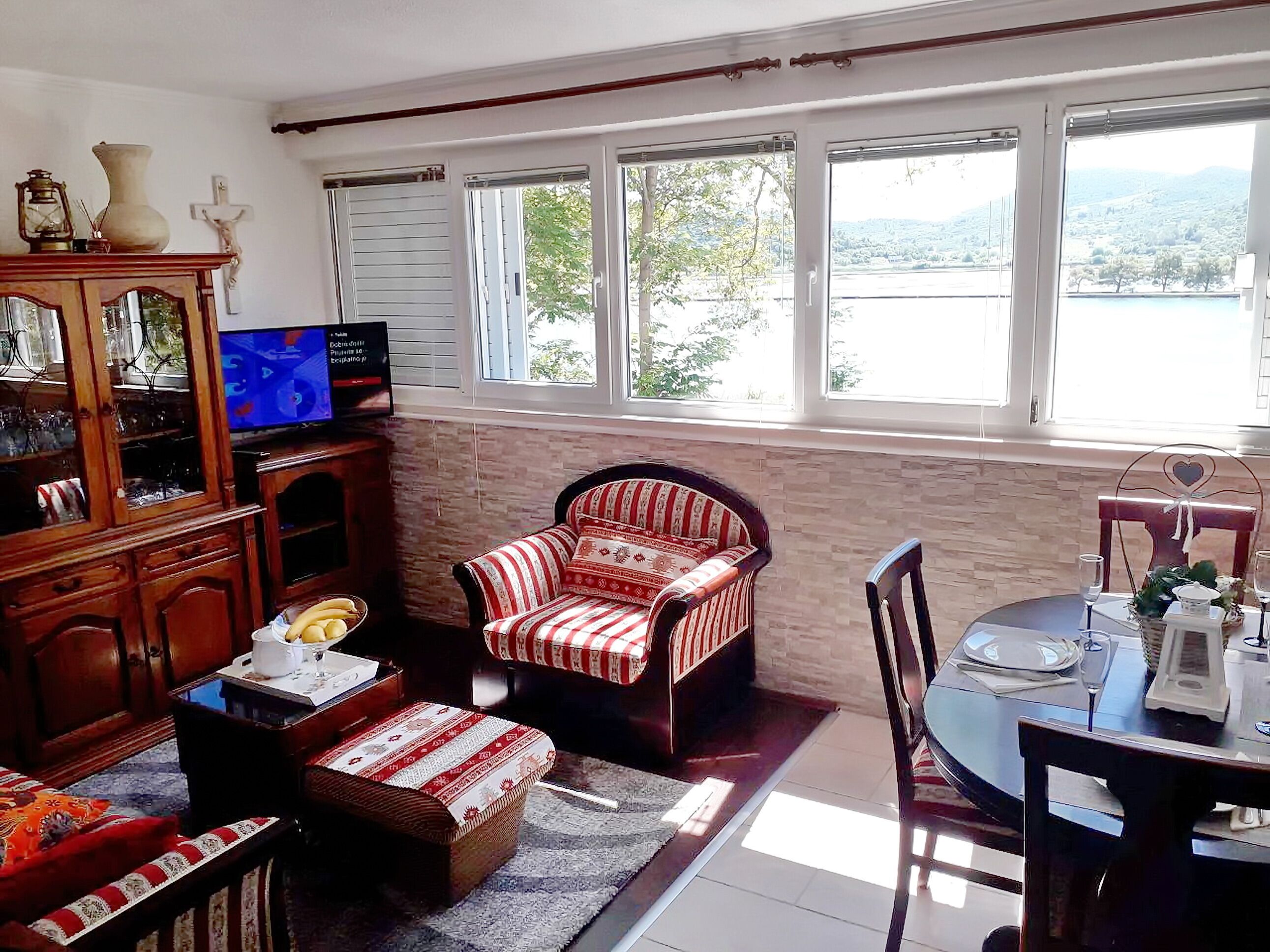 Apartment (One Bedroom Apartment) | Living room | 32-inch flat-screen TV with satellite channels, DVD player