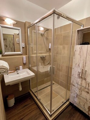 Shower, hair dryer, towels, soap