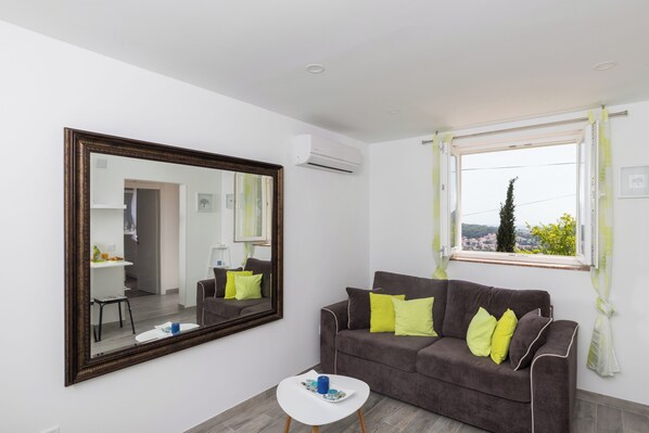 Apartment (One Bedroom Apartment with Terrace an) | Living room | 32-inch flat-screen TV with digital channels - Apartment Semi (Dubrovnik)