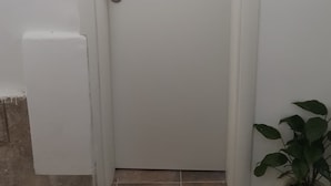 A closed white door with a keyhole and a handle. - Rooms Milena (Dubrovnik)