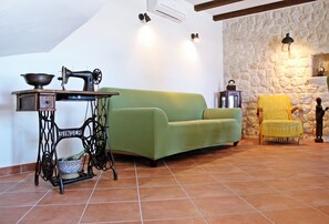 Villa (Three Bedroom Villa) | Living room | 32-inch flat-screen TV with cable channels