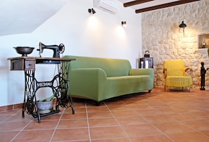 Villa (Three Bedroom Villa) | Living room | 32-inch flat-screen TV with cable channels