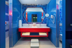 Themed Junior Suite | Bathroom | Shower, hair dryer, bathrobes, slippers