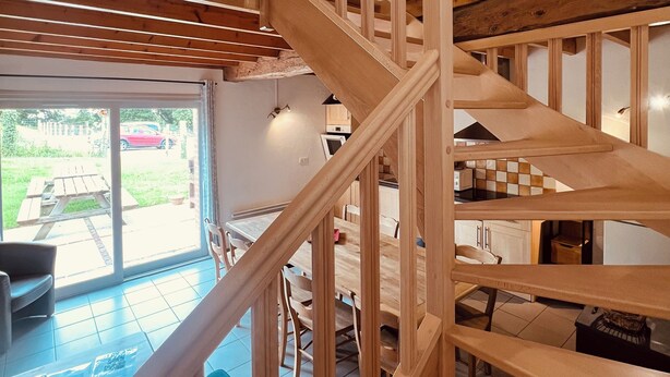 A multi-level wooden staircase connecting different areas of a house. - Gite with heated indoor pool on the Opal Coast (Tingry)
