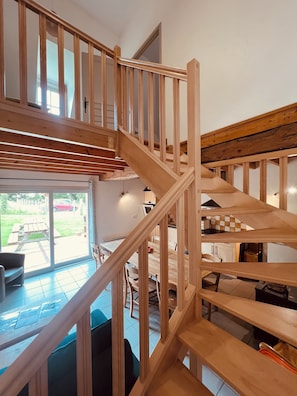 A multi-level wooden staircase connecting different areas of a house.