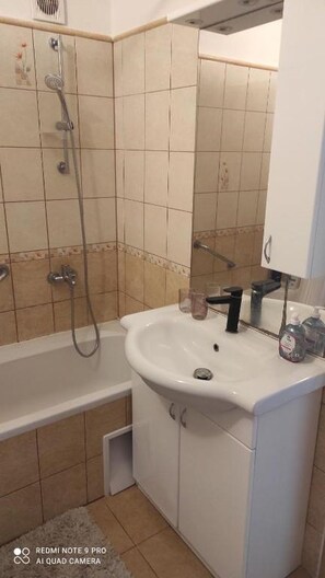 Shower, hair dryer, towels, soap - Apartmán Sofia is situated in Levice, district Nitra (Levice)