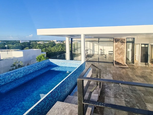 Relax by the pool surrounded by a stunning view of the surrounding landscape.