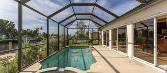 GoGo House.  Charming 2 BR, 2 BA, Waterfront Vacation Rental in Port Charlotte, FL, w/Heated Private Pool & Spa
