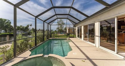 GoGo House. Charming 2 BR, 2 BA, Waterfront Vacation Rental in Port Charlotte, FL, w/Heated Private Pool & Spa