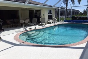 A heated pool - This house is a 3 bedroom(s), 2 bathrooms, located in Port Charlotte, FL. (Port Charlotte)
