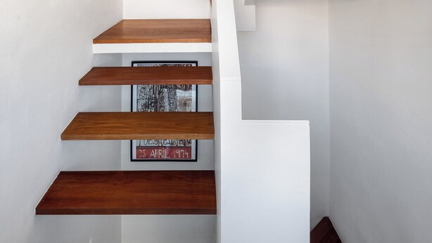 A modern staircase with wooden steps and white walls. - Flora4 Flora Apartments, Studio on 2nd Floor (Porto)