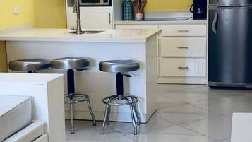 Fridge, microwave, stovetop, coffee/tea maker