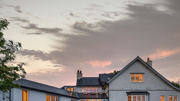 A large, two-story house with a well-maintained lawn and a wooden fence. - Higher Mapstone in Lustleigh (Newton Abbot)
