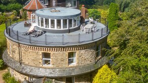 A circular stone building with a rooftop terrace and a central courtyard. - The Round House in Ilfracombe (Ilfracombe)