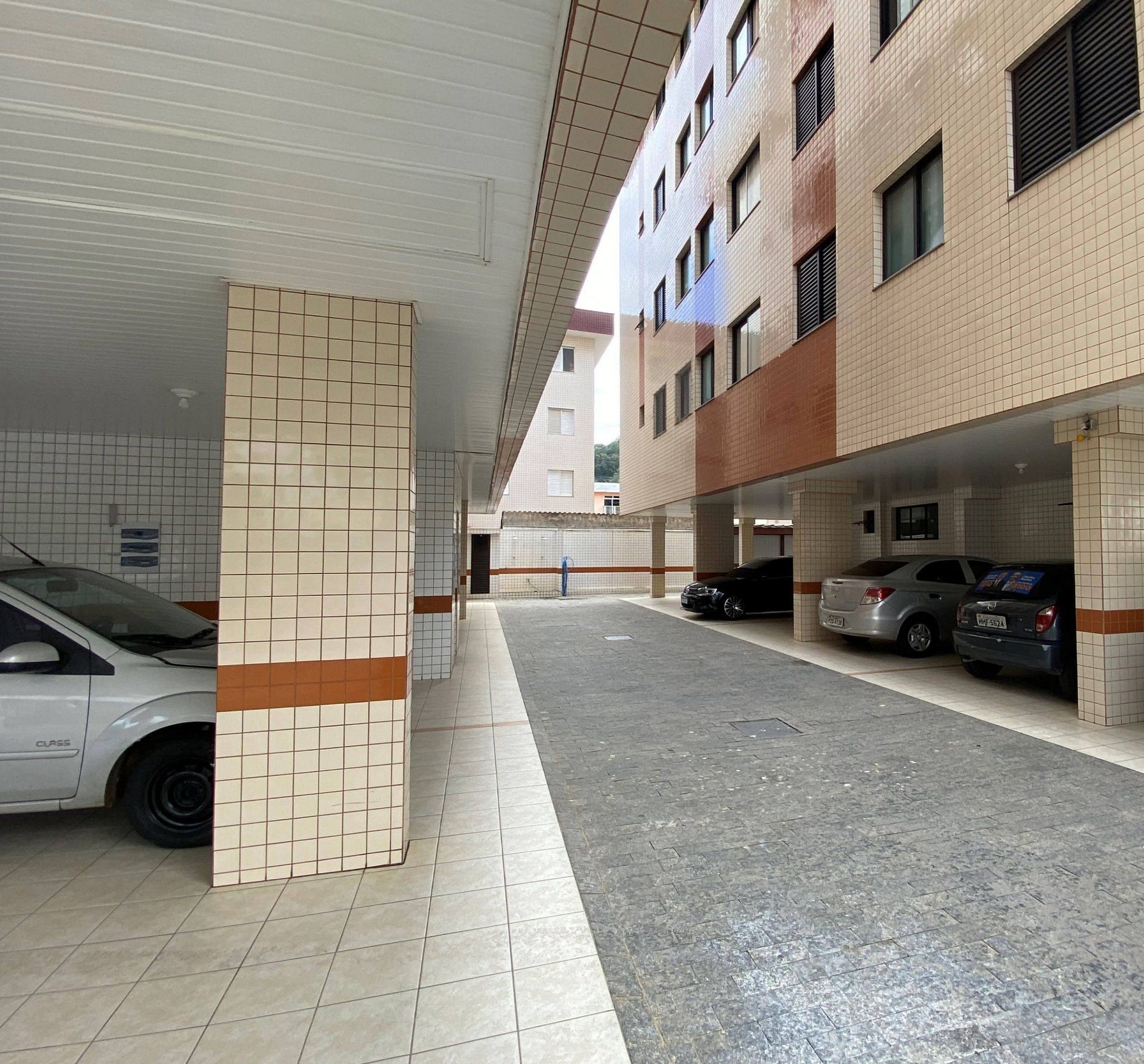 A parking garage with multiple levels and cars parked.