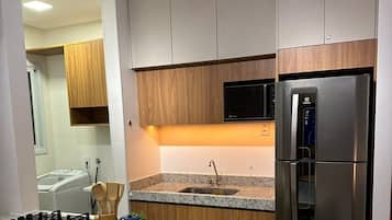 Fridge, microwave, oven, cookware/dishes/utensils