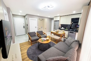 Superior City View Suite | Living area | 55-inch LED TV with satellite channels, heated floors - Luxury Life Suites (Istanbul)