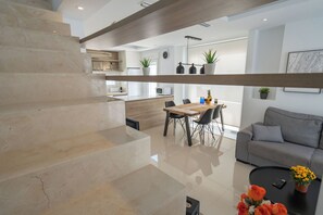 Superior Duplex | Living area | 50-inch Smart TV with digital channels, Netflix, heated floors