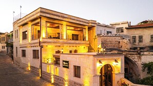 A two-story building with a sign reading 'Library Cave House.' - Library Cave Hotel (Urgup)
