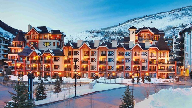 A large, multi-story hotel with a symmetrical facade, multiple balconies, and a central courtyard. - Ski In, Ski Out 1 Bedroom at the Eagle Bahn Gondola in Lionshead (Vail)