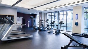 A modern gym with treadmills, elliptical machines, and free weights. - WorldMark Anaheim - 2 Bedroom Presidential Accessible (Anaheim)