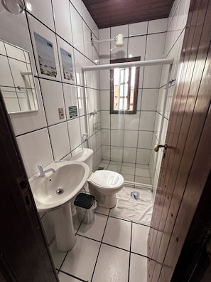 Shower, hair dryer, towels, toilet paper