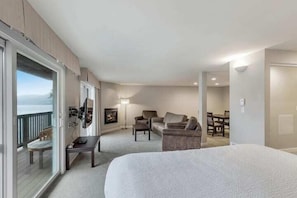 Deluxe Room, Kitchenette, Sea View | Living area | Fireplace