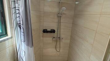 Shower, eco-friendly toiletries, hair dryer, towels