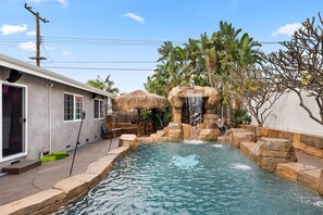 Outdoor pool, a heated pool - Enchanted Haven Retreat By Disneyland @Stay.ehr IG (Orange)