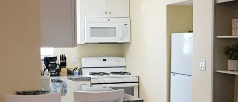 Coffee/tea maker, fridge, microwave, toaster