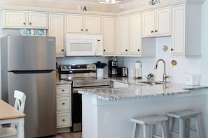 Coffee/tea maker, fridge, microwave, toaster