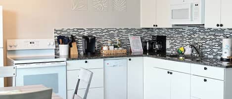 Coffee/tea maker, fridge, microwave, oven