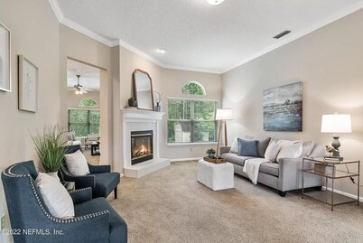 Four-bedroom mini estate, minutes from downtown Jax with a sunroom and backyard