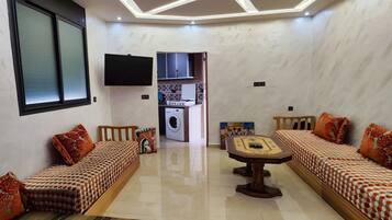 Studio trung tâm thành phố | Khu phòng khách | TV màn hình phẳng