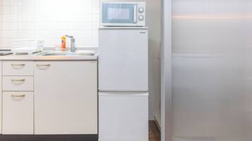 Design Apartment | Private kitchen | Full-size fridge, microwave, stovetop, toaster