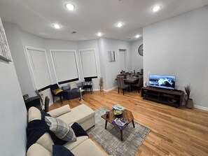 Living area - Family Gathering- Spacious 3-Bedroom Apt (Newark)