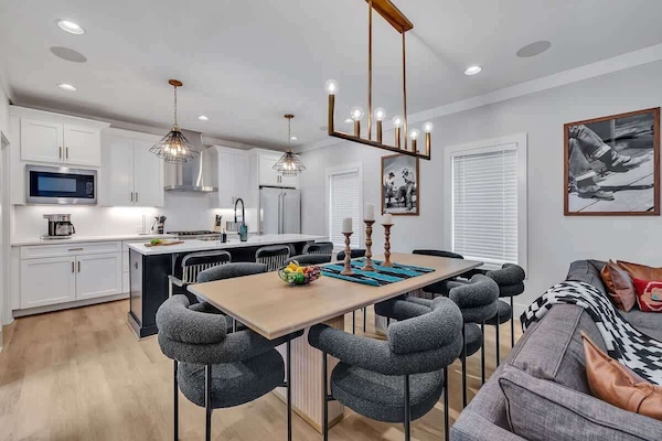 2nd Floor: Formal dining table between the living room and kitchen offering a large table to accommodate 8 guests.