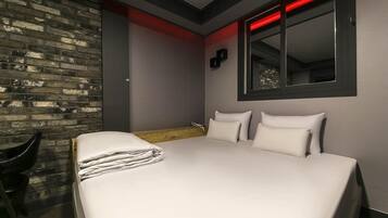 Premium Double Room | Living area | 65-inch flat-screen TV with cable channels, Netflix, streaming services