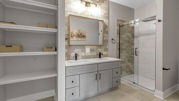 Shower, hair dryer, towels, toilet paper