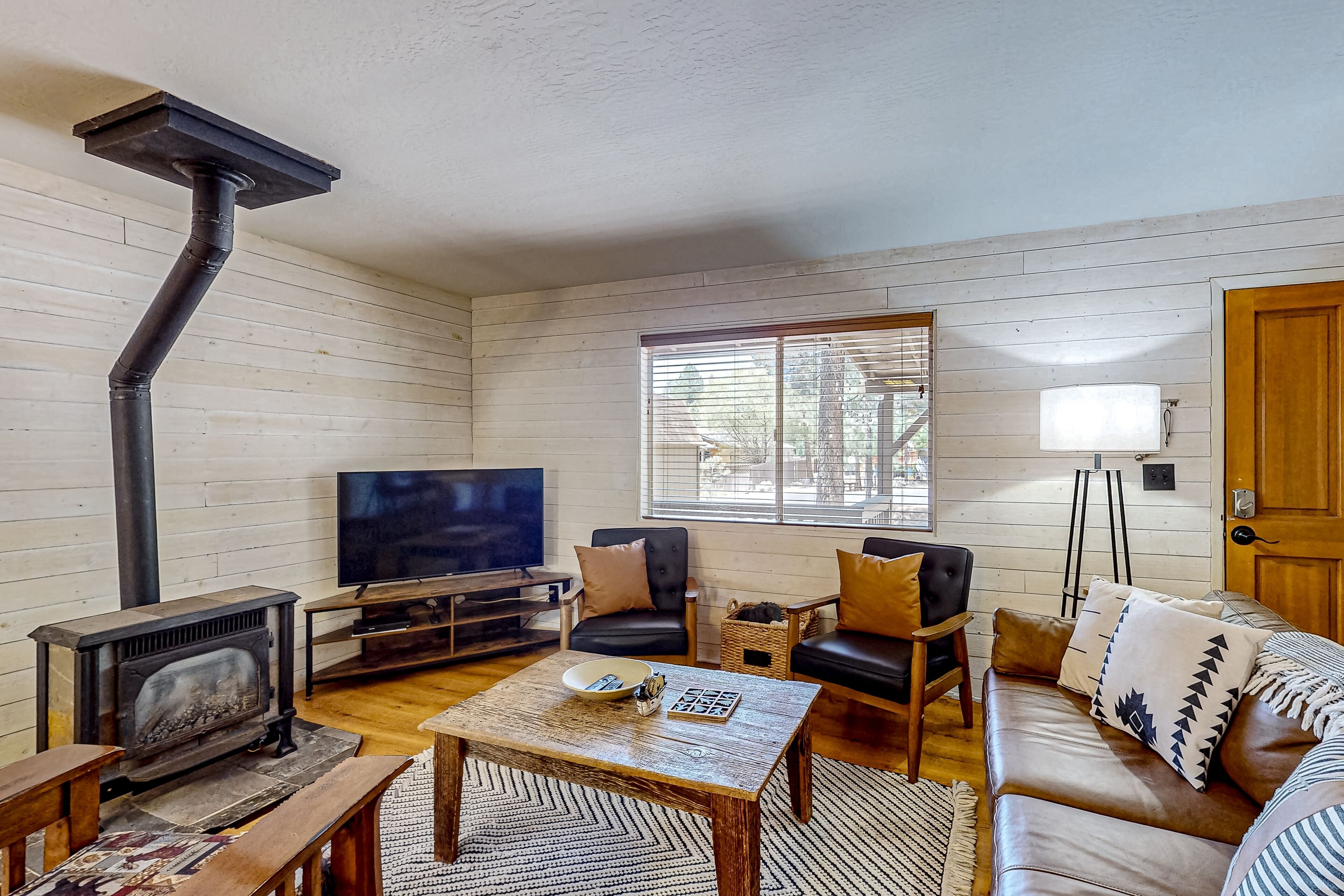 Cabin wraparound deck, games, and grill