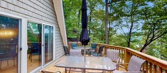 Cozy A-frame home with fire pit, deck, pickleball court, and covered boat slip
