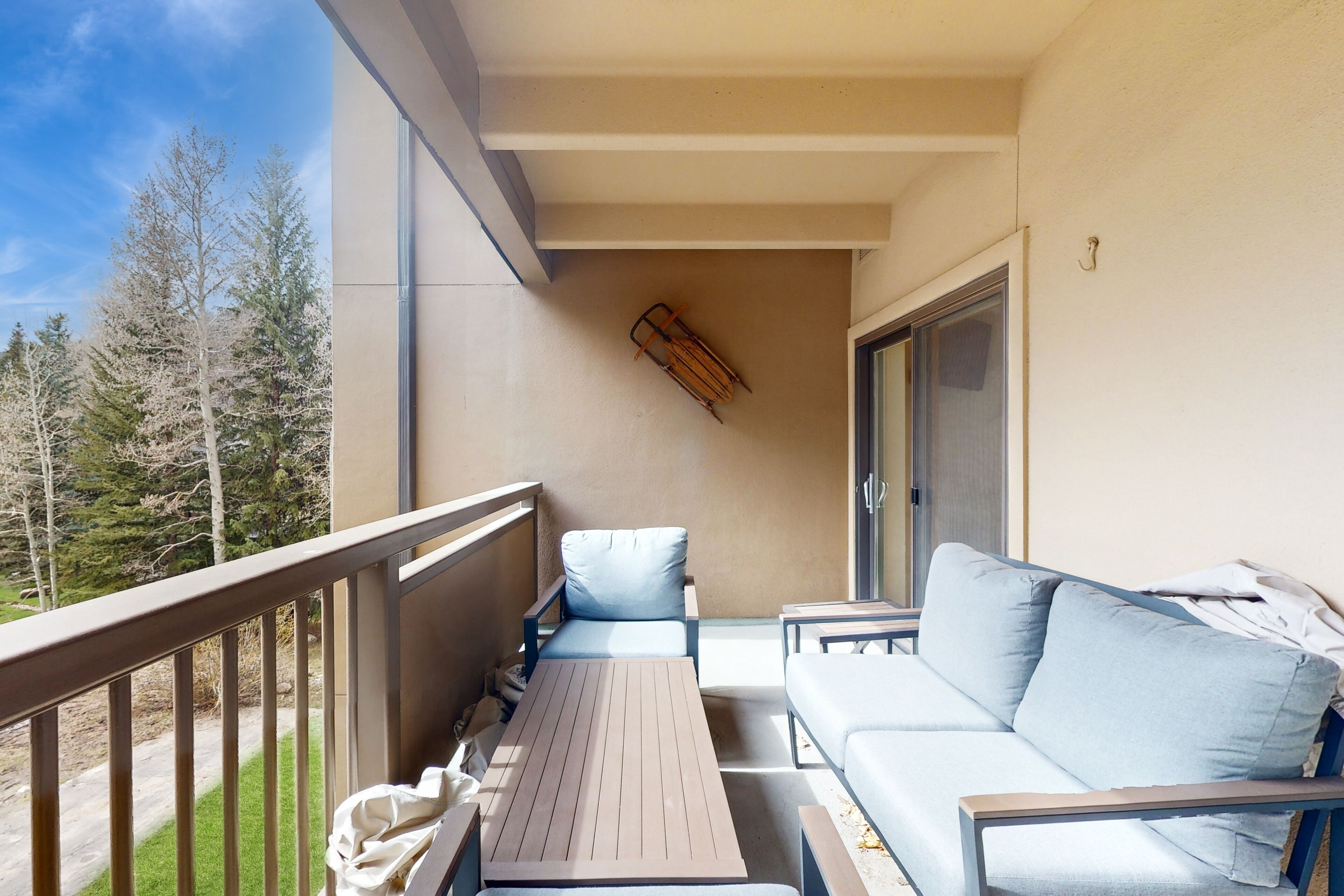 Mountain view condo with large balcony, pool & hot tub - steps to ski shuttle