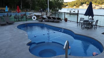 Seasonal outdoor pool, open 10:00 AM to 8:00 PM, pool umbrellas