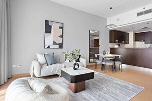 Grand Apartment, Balcony | Living area | 50-inch LED TV with digital channels