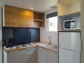 Fridge, microwave, stovetop, coffee/tea maker