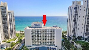 A hotel with a view of the ocean, named Marco Polo Beach Resort. - One Step to The Beach (Sunny Isles)